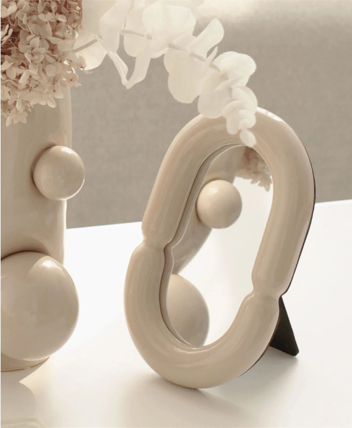 Elegant Oval Mirror with Sculptural Shape