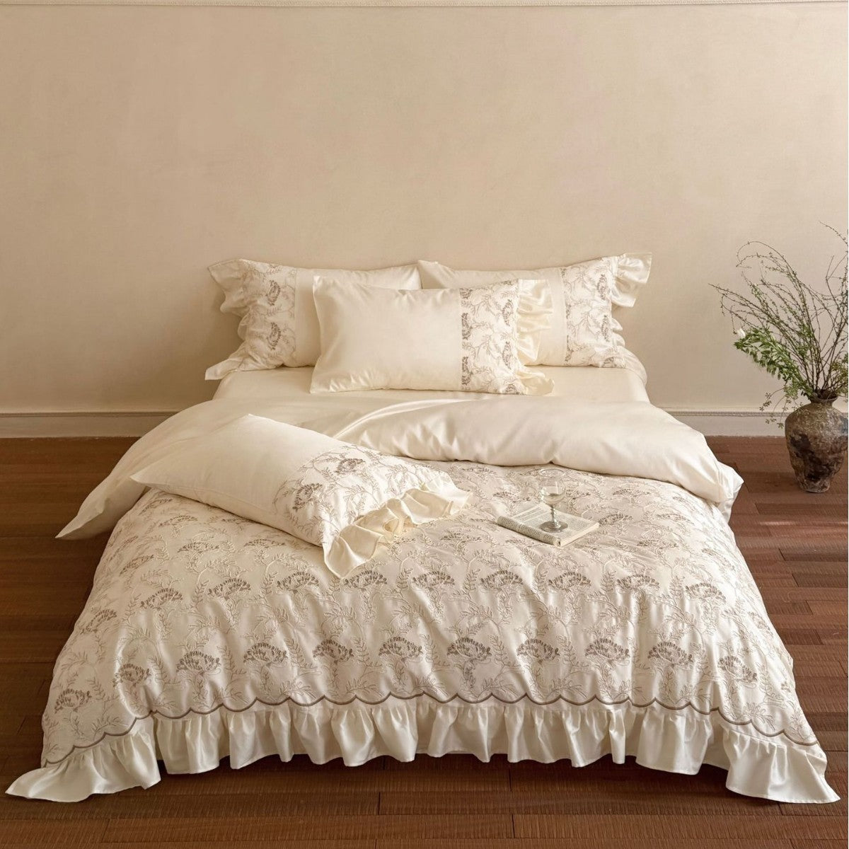 Floral Embroidered Quilt with Satin Ruffles and Decorative Piping