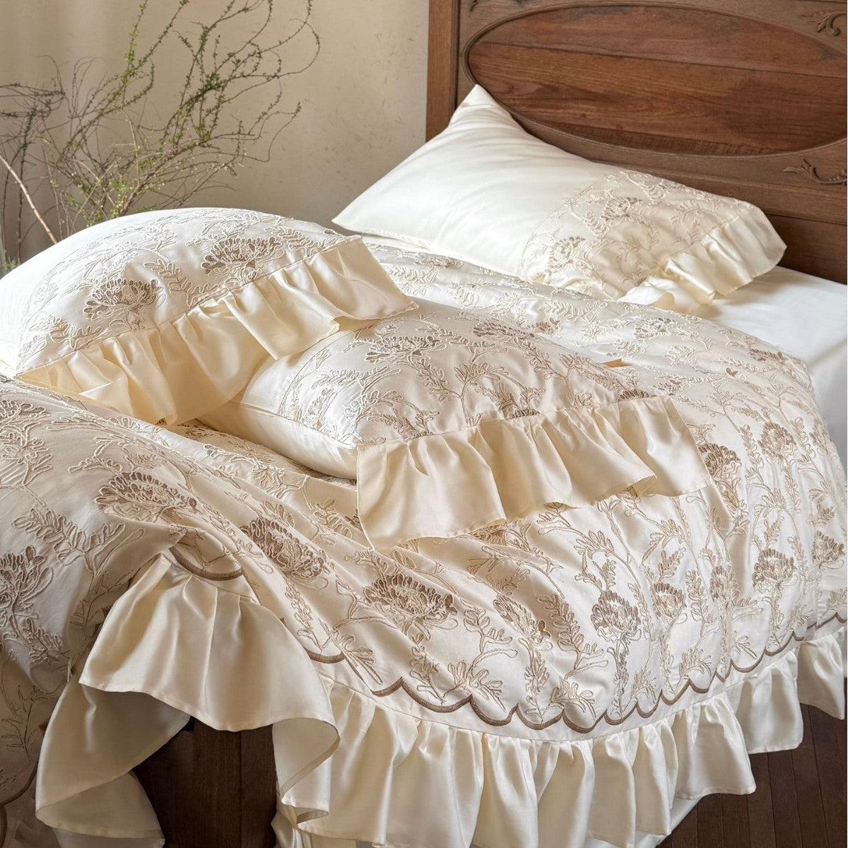 Floral Embroidered Quilt with Satin Ruffles and Decorative Piping